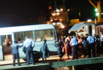 Survivors assisted by police upon arrival at the Point Cruz Wharf.