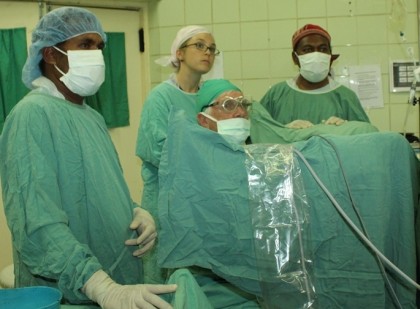 Dr Alex Cato Dr Kathryn Rzetelski West and two local doctors performing surgery on a patient at the National Referral Hospital during the visit. Photo: Australian High Com.
