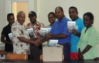 Members of the Writers Association handing over the books to a Curriculum staff. Photo credit: Anouk Ride.