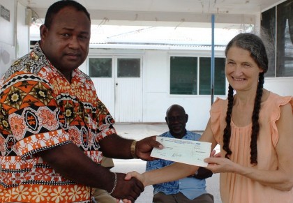Acting Prime Minister Hon Manasseh Maelanga handover the cheque of 2 million dollar to Dr Jane Bottom. Photo credit: GCU.