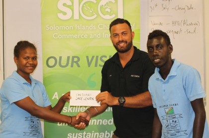 Handover of sponsorship cheque for San Isidoro Training Centre, 16 July 2014. Photo credit: SICCI.