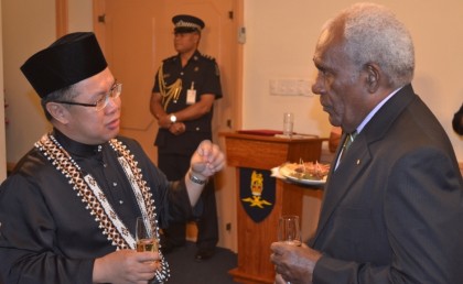 Ambassador Jilid Kuminding chats with Sir Frank during the presentation ceremony. Photo credit: GCU.
