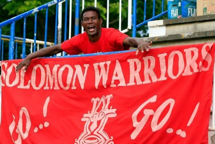 A fan with a Solomon Warriors banner. Photo credit: Facebook.