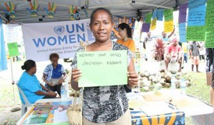 SIBC's Gina Maka in front of a stall at the celebrations in Honiara. Photo credit: UN Women Solomon Islands.