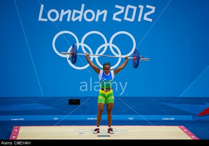 London, UK. 30th July, 2012. Tegu Wini Jenly (SOL) lifts 65kg in the Womens 58kg Group B Snatch event during the Weightlifting Competition on Day 3 of the London 2012 Olympic Games at ExCeL. Photo credit: www.alamy.com