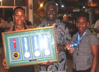 PM Sogavare with weightlifters Jenly Tegu Wini and Mary Kini Lifu. Ms Wini snatched 3 gold medals whilst Ms Lifu secured two silver medals. Photo credit: OPMC.