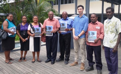 Permanent Secretary Ethel Sigimanu (third left) with research stakeholders displaying the report. Photo credit: SIBC.