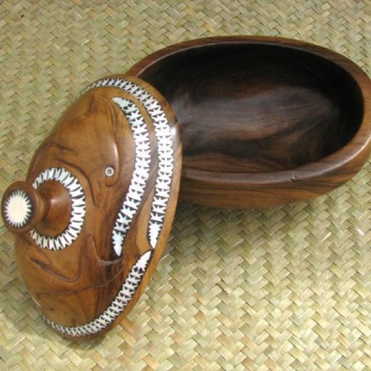Carved dolphin bowl with lid. Photo credit: langis.co.nz