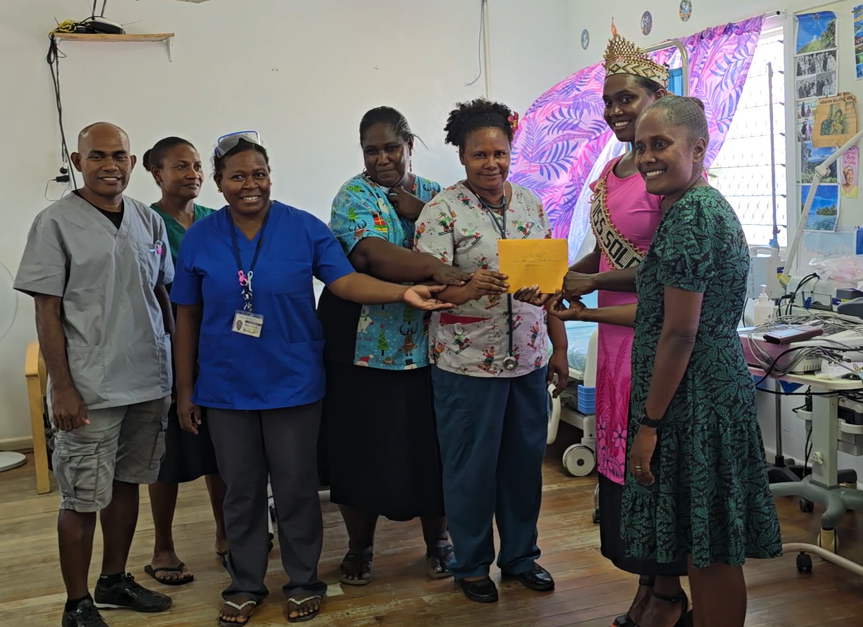 Miss Solomon presents donation to the NRH Cancer Unit